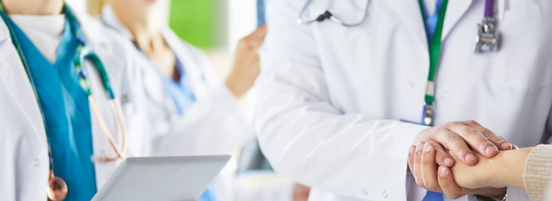 doctors-using-tablet-hospital-standing-office (1)